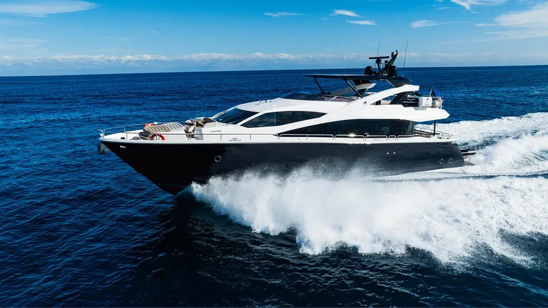 Golden Ours Yacht Photos Pics Luxurious 2019 Sunseeker Motoryacht cruising on open sea under clear blue sky.
