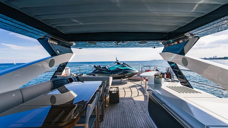 Golden Ours Yacht Photos Pics Luxurious 2019 Sunseeker motoryacht deck with jet ski, ocean view, and modern amenities.