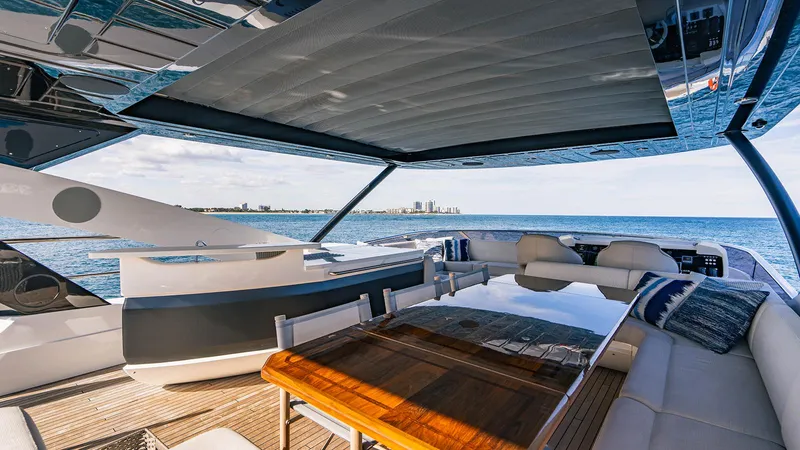 Golden Ours Yacht Photos Pics Luxurious 2019 Sunseeker Motoryacht interior with ocean view, featuring elegant seating and dining area.