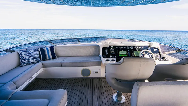 Golden Ours Yacht Photos Pics Luxurious 2019 Sunseeker Motoryacht helm with plush seating and ocean view.