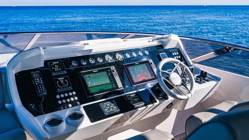 Golden Ours Yacht Photos Pics Control panel of a 2019 Sunseeker Motoryacht with ocean view.