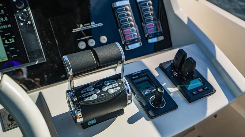 Golden Ours Yacht Photos Pics Control panel of a 2019 Sunseeker Motoryacht with throttle and navigation controls.
