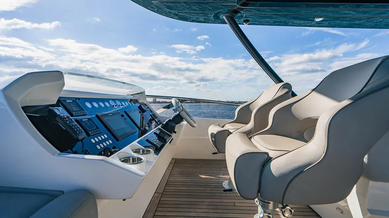 Golden Ours Yacht Photos Pics Luxurious 2019 Sunseeker Motoryacht helm with modern controls and plush seating.