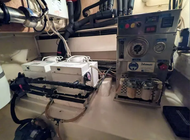  Yacht Photos Pics Engine room of 2006 Mochi Craft 51 Dolphin yacht, featuring mechanical equipment and control panels.