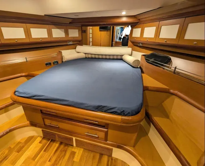  Yacht Photos Pics Luxurious cabin interior of 2006 Mochi Craft 51 Dolphin yacht with wooden finishes.