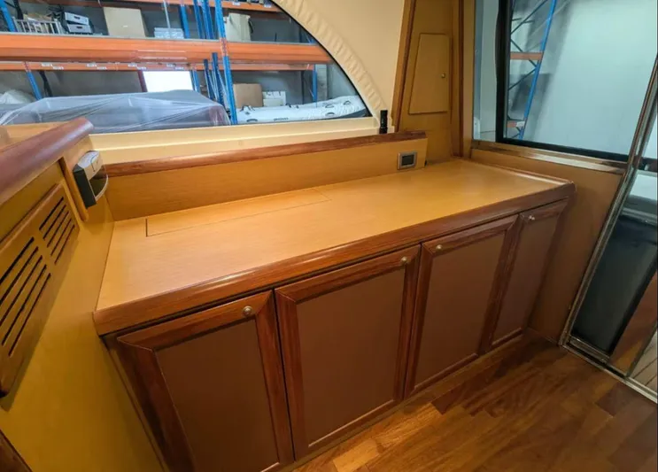  Yacht Photos Pics Interior of 2006 Mochi Craft 51 Dolphin yacht with wooden cabinetry and countertop.