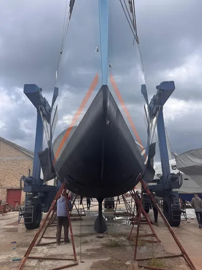 Manona (name Reserved For Owner) Yacht Photos Pics 2018 Beneteau Oceanis Yacht 62 in dry dock, viewed from the front under cloudy skies.