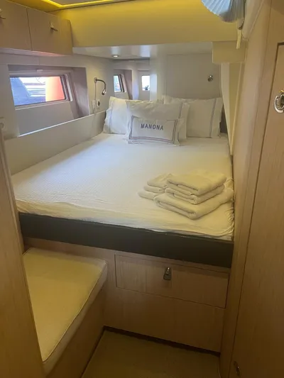 Manona (name Reserved For Owner) Yacht Photos Pics Luxurious cabin interior of 2018 Beneteau Oceanis Yacht 62 with cozy bedding.
