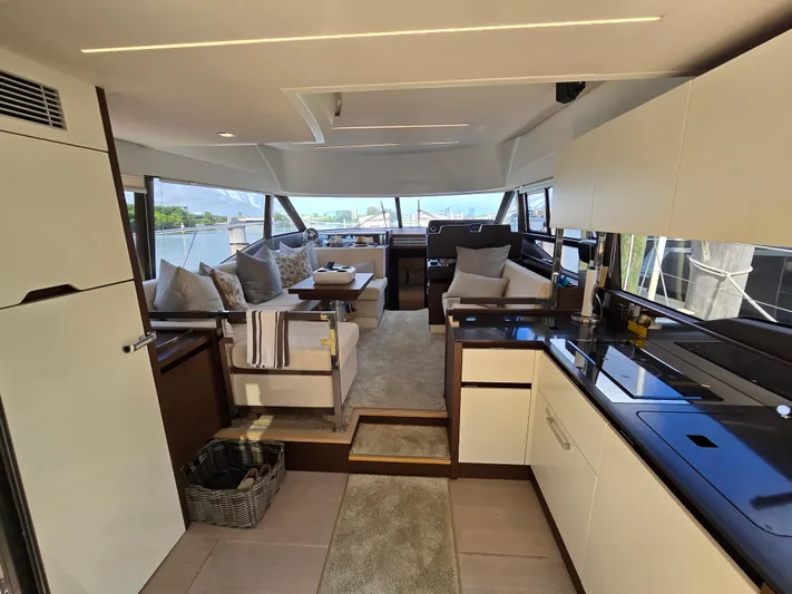  Yacht Photos Pics Luxurious interior of a 2018 Prestige 460 yacht with modern kitchen and seating area.