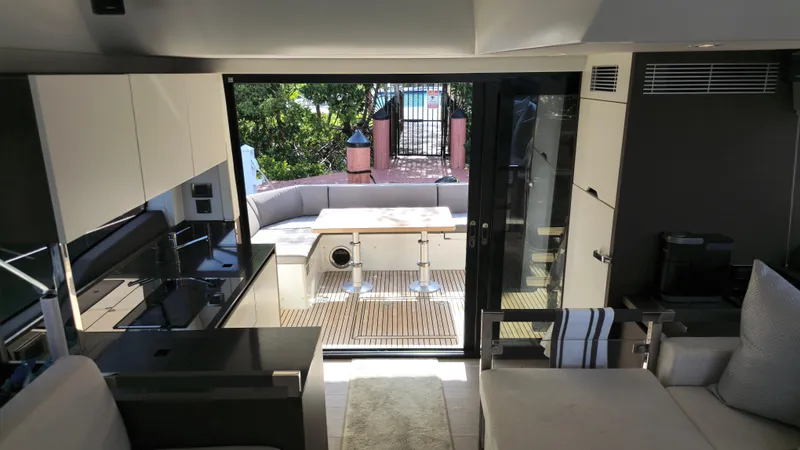  Yacht Photos Pics Interior view of 2018 Prestige 460 yacht, featuring modern design and outdoor seating area.