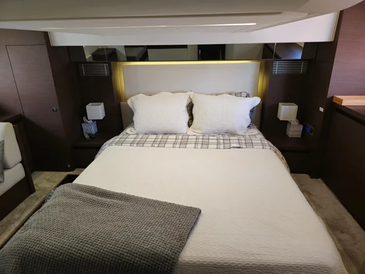 Yacht Photos Pics Luxurious bedroom interior of 2018 Prestige 460 yacht with elegant bedding and modern design.