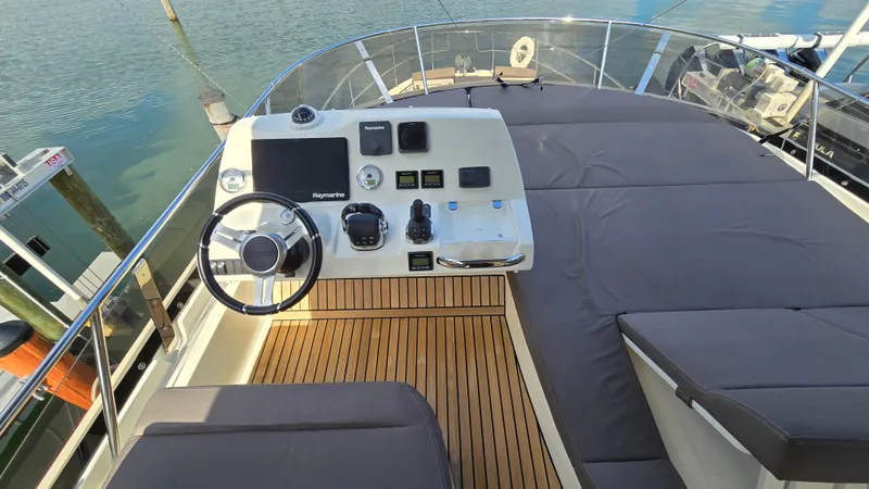  Yacht Photos Pics 2018 Prestige 460 yacht helm with modern controls and spacious sunbathing area.