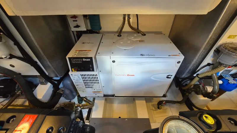  Yacht Photos Pics Engine room of 2018 Prestige 460 yacht featuring Cummins Onan generator.