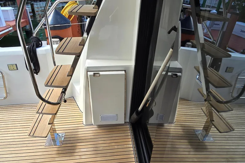  Yacht Photos Pics Staircase on 2018 Prestige 460 yacht with wooden steps and sleek design.