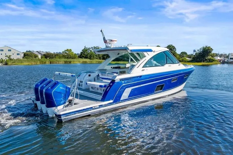  Yacht Photos Pics 2024 Formula 380 Super Sport Crossover OB boat cruising on a serene lake.