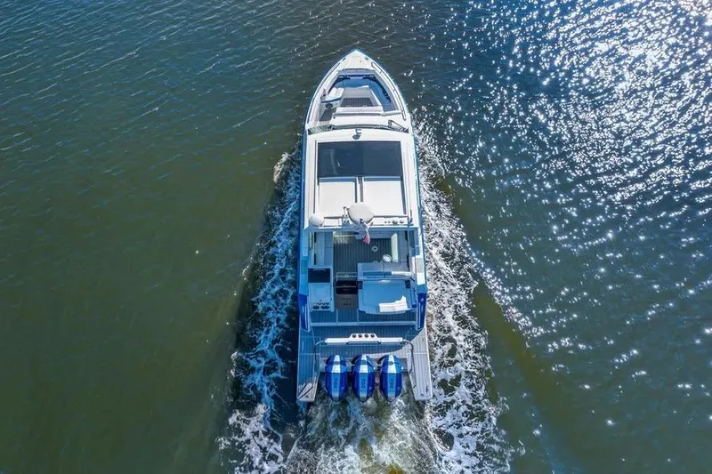  Yacht Photos Pics 2024 Formula 380 Super Sport Crossover OB cruising on open water, aerial view.