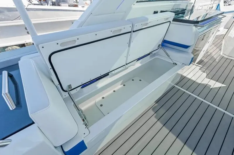  Yacht Photos Pics 2024 Formula 380 Super Sport Crossover OB boat storage compartment open on deck.