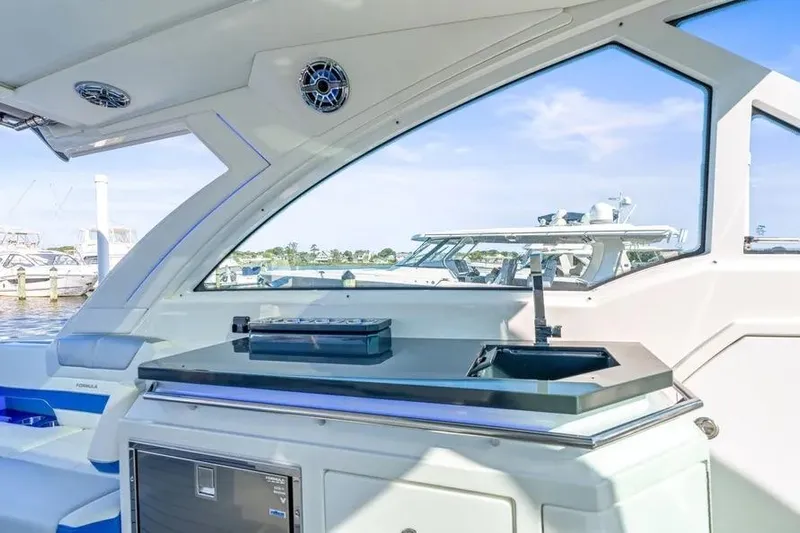  Yacht Photos Pics 2024 Formula 380 Super Sport Crossover OB interior with sleek kitchenette and marina view.