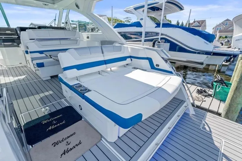  Yacht Photos Pics 2024 Formula 380 Super Sport Crossover OB luxury boat interior with seating and welcome mats.