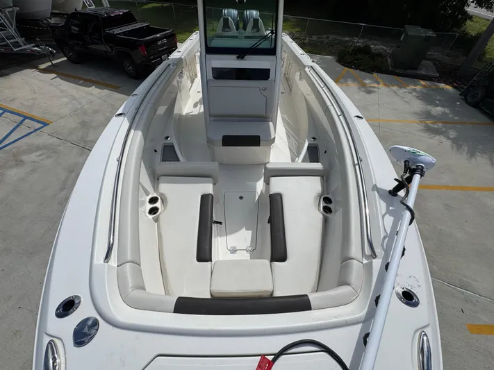  Yacht Photos Pics 2023 Sailfish 312 CC boat interior with seating and fishing rod holder.
