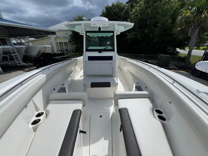  Yacht Photos Pics 2023 Sailfish 312 CC boat interior with seating and cup holders.