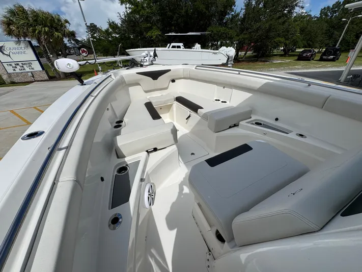  Yacht Photos Pics 2023 Sailfish 312 CC boat interior with seating and cup holders.