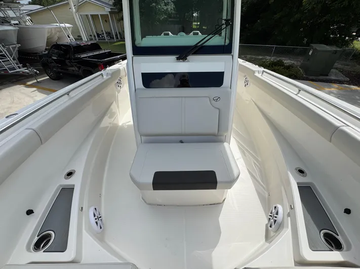 Yacht Photos Pics 2023 Sailfish 312 CC boat interior with seating and storage compartments.