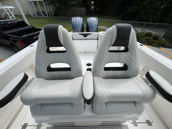  Yacht Photos Pics 2023 Sailfish 312 CC boat seats with quilted design and armrests.