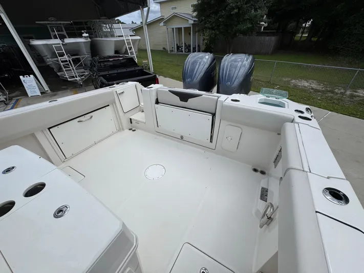  Yacht Photos Pics 2023 Sailfish 312 CC boat interior with dual engines and spacious deck.