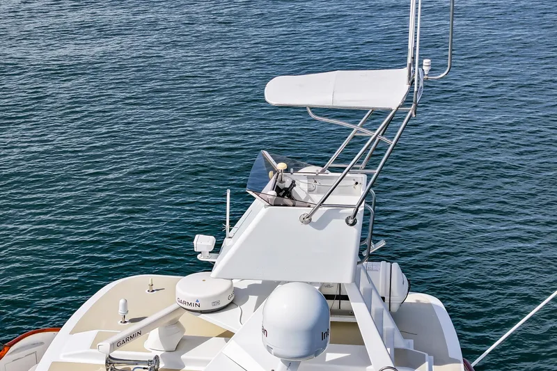 Amakua Yacht Photos Pics 1970 Hargrave Yachtfisher with navigation equipment on calm water.