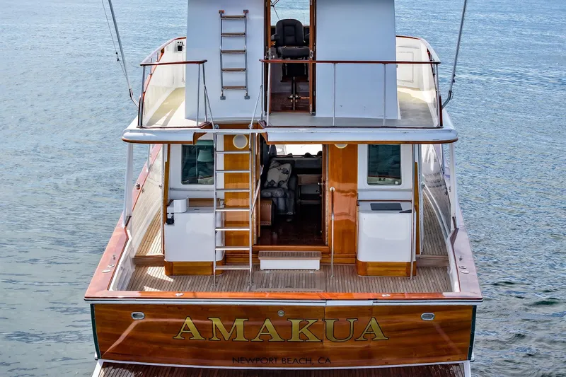 Amakua Yacht Photos Pics 1970 Hargrave Yachtfisher "AMAKUA" docked at Newport Beach, featuring elegant wooden deck.