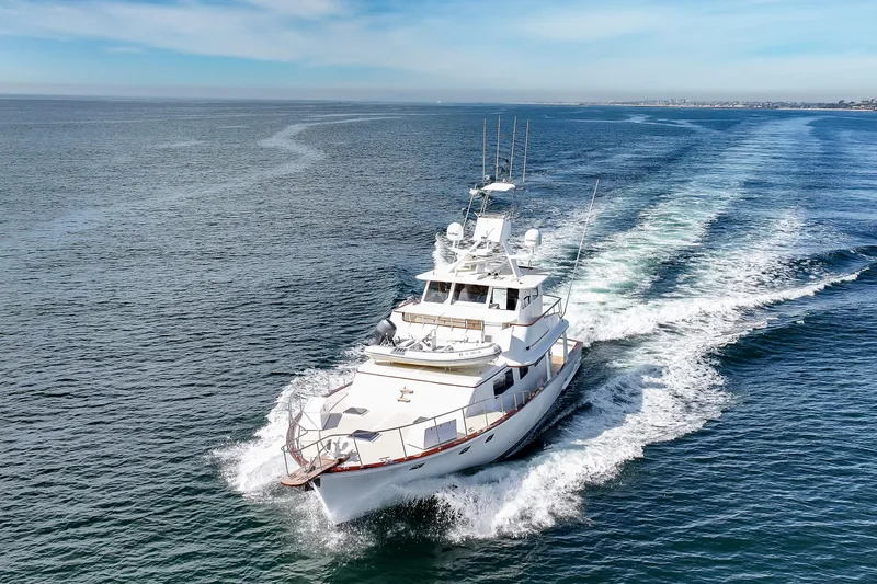 Amakua Yacht Photos Pics 1970 Hargrave Yachtfisher cruising on open sea under clear blue sky.