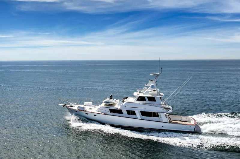 Amakua Yacht Photos Pics 1970 Hargrave Yachtfisher cruising on open sea under clear blue sky.