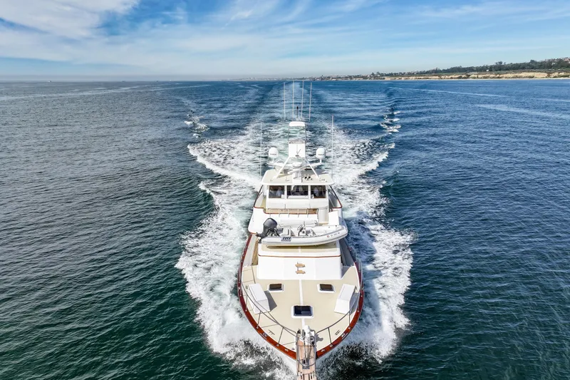 Amakua Yacht Photos Pics 1970 Hargrave Yachtfisher cruising on open water under a clear blue sky.