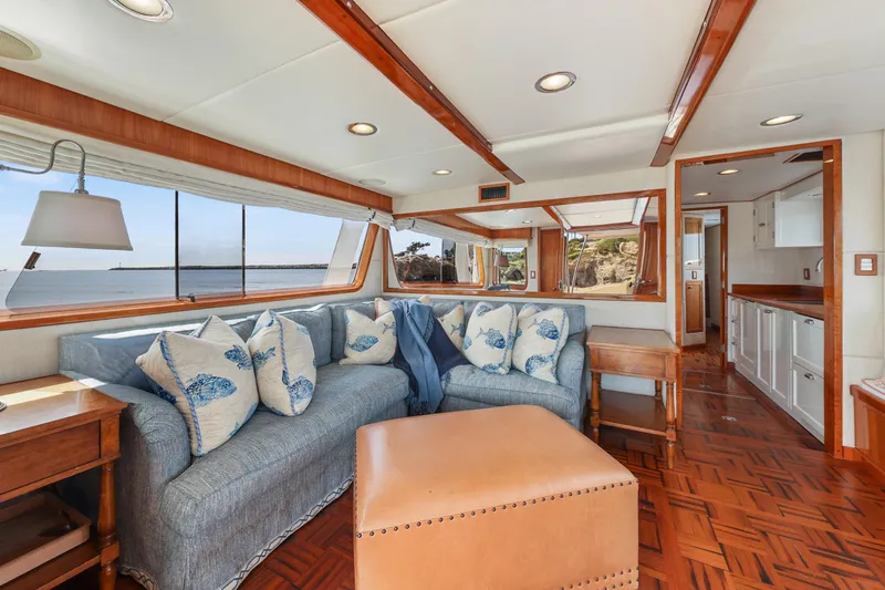 Amakua Yacht Photos Pics Luxurious 1970 Hargrave Yachtfisher interior with ocean view, featuring elegant seating and wooden accents.