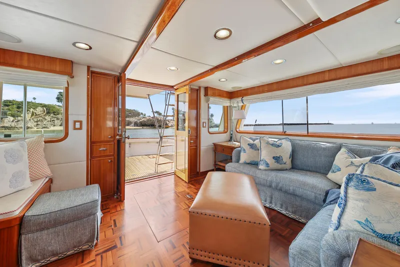 Amakua Yacht Photos Pics Luxurious 1970 Hargrave Yachtfisher interior with elegant wood finishes and ocean view.
