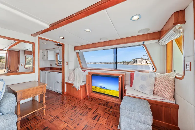 Amakua Yacht Photos Pics Interior of 1970 Hargrave Yachtfisher with elegant wood finishes and scenic window view.