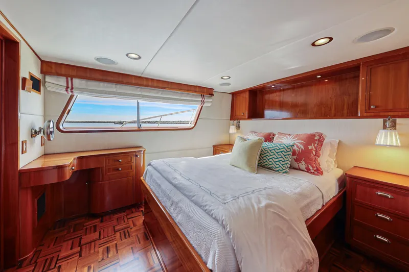 Amakua Yacht Photos Pics Luxurious 1970 Hargrave Yachtfisher bedroom with elegant wood finishes and ocean view.