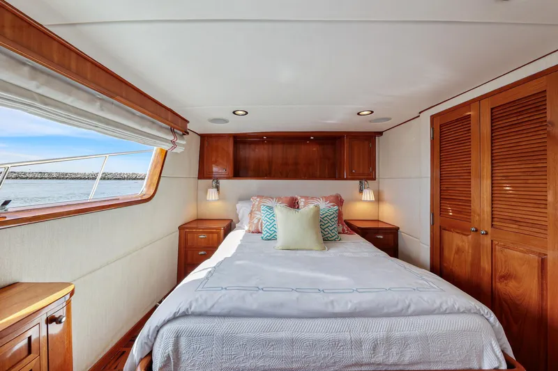 Amakua Yacht Photos Pics Luxurious 1970 Hargrave Yachtfisher bedroom with wood accents and ocean view.