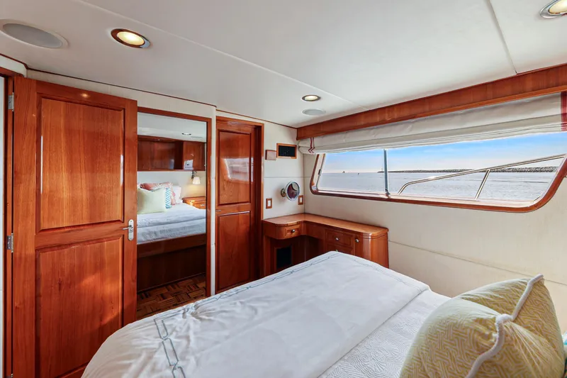 Amakua Yacht Photos Pics Luxurious 1970 Hargrave Yachtfisher cabin with wooden interior and ocean view.