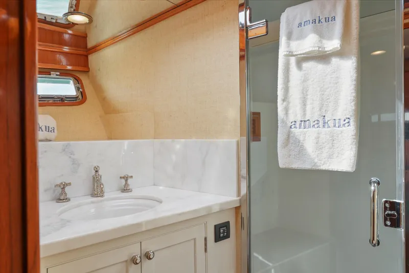 Amakua Yacht Photos Pics Luxurious bathroom on 1970 Hargrave Yachtfisher with marble sink and embroidered towels.