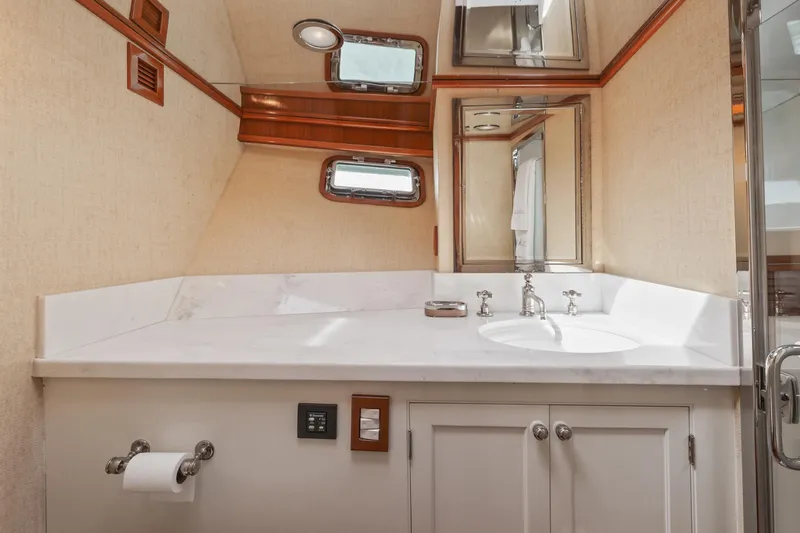 Amakua Yacht Photos Pics Luxurious bathroom on a 1970 Hargrave Yachtfisher, featuring elegant fixtures and a sleek design.