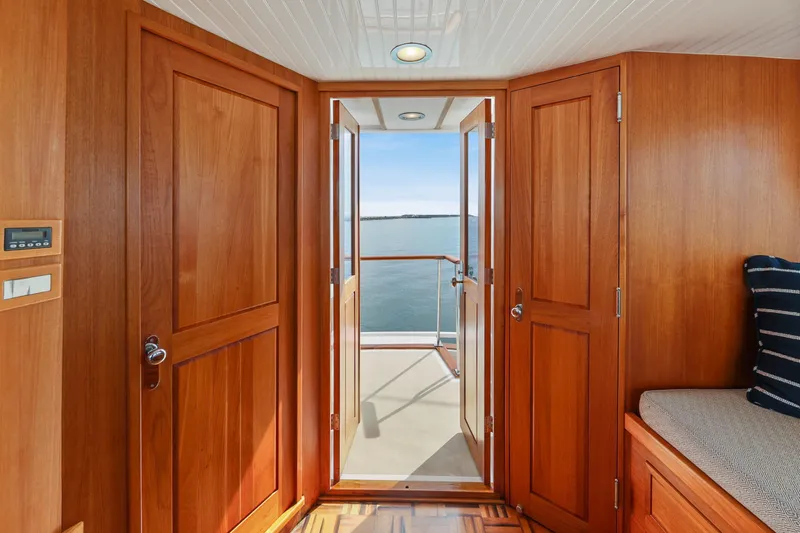 Amakua Yacht Photos Pics Interior view of 1970 Hargrave Yachtfisher with wooden doors and ocean view.
