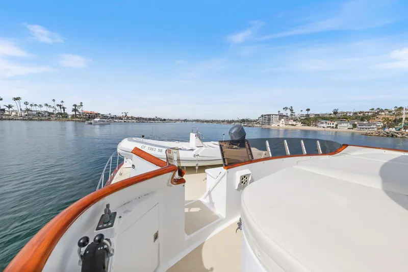 Amakua Yacht Photos Pics 1970 Hargrave Yachtfisher cruising in a scenic coastal area with clear blue skies.