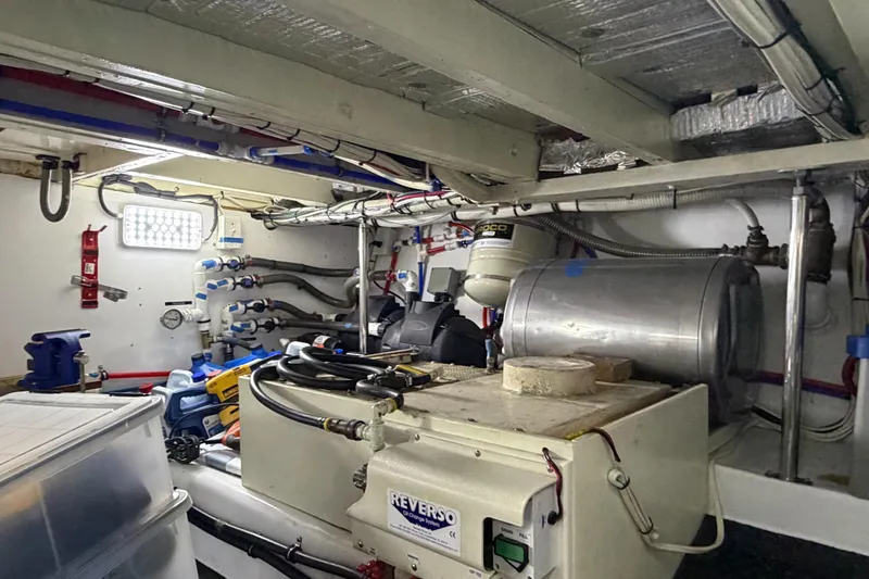 Amakua Yacht Photos Pics Engine room of a 1970 Hargrave Yachtfisher, showcasing mechanical equipment and piping.