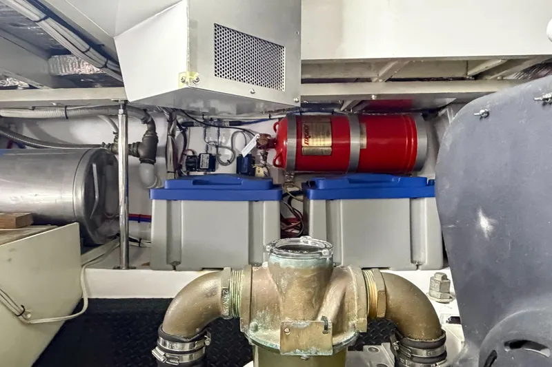 Amakua Yacht Photos Pics Engine room of a 1970 Hargrave Yachtfisher, featuring mechanical components and storage tanks.