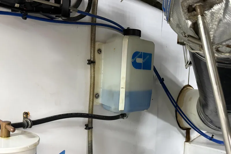 Amakua Yacht Photos Pics Engine compartment of a 1970 Hargrave Yachtfisher with Cummins Marine coolant reservoir.