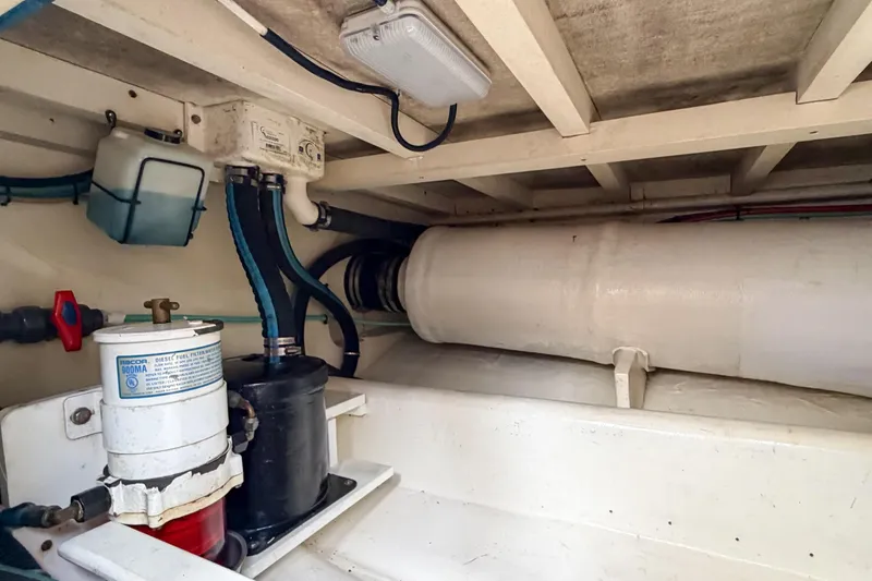 Amakua Yacht Photos Pics Engine room of a 1970 Hargrave Yachtfisher, showcasing fuel filtration system and piping.