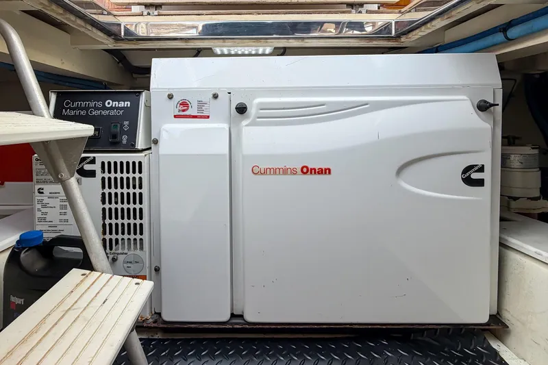 Amakua Yacht Photos Pics Cummins Onan marine generator inside 1970 Hargrave Yachtfisher, showcasing engine room details.