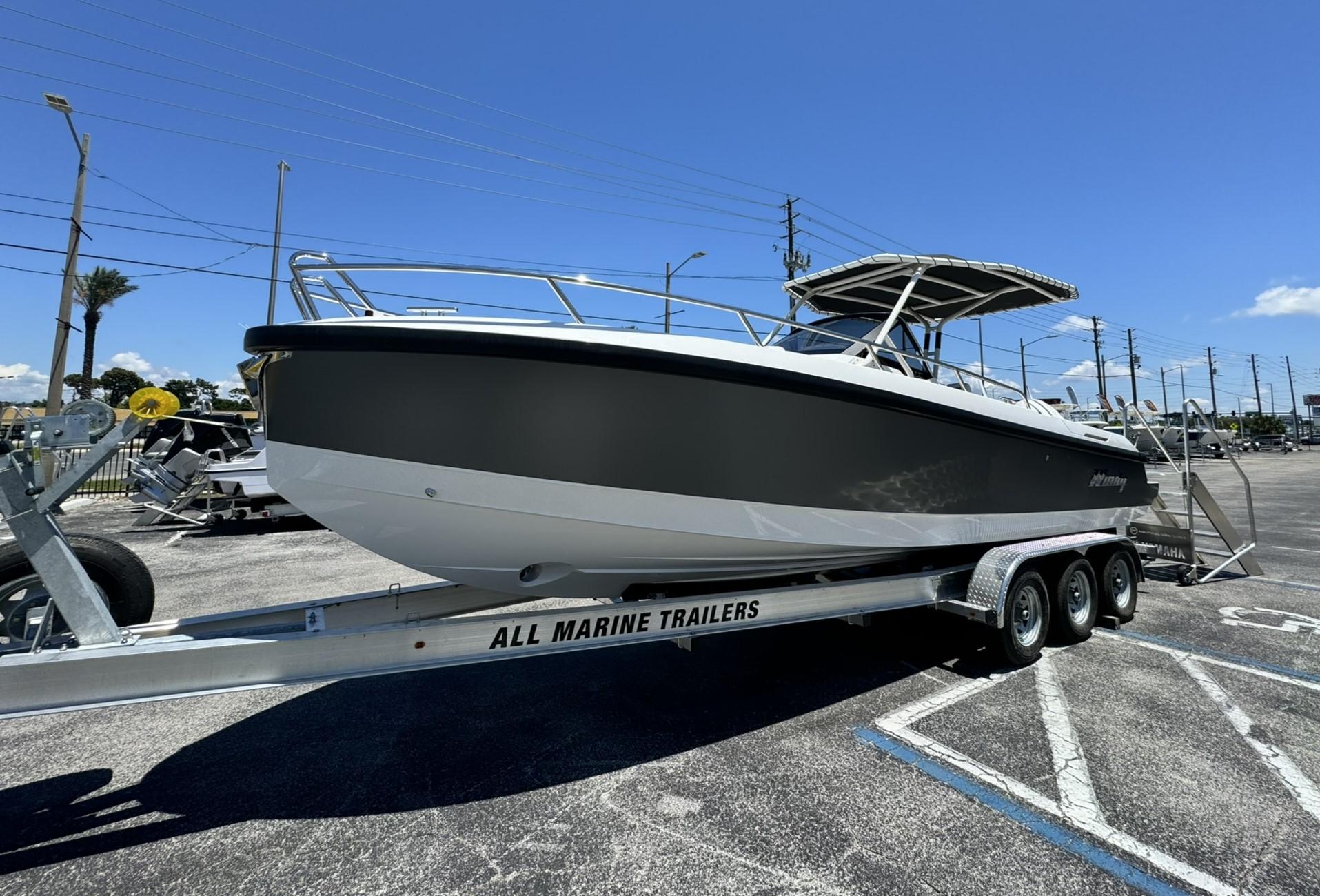 2024 Windy SR28 CC boat on a trailer in a parking lot.